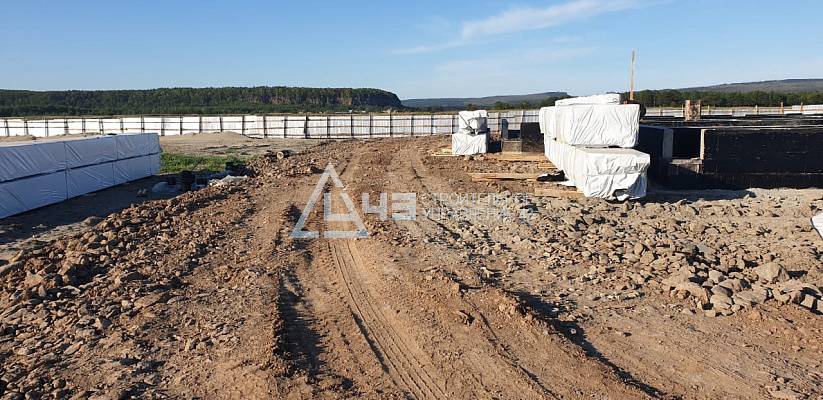 Delivery of house kits and the start of construction of the recreation center