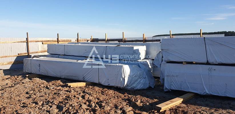 Delivery of house kits and the start of construction of the recreation center